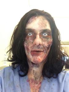 Second phase of zombie makeup, with more latex, cotton balls and fake blood and contacts
